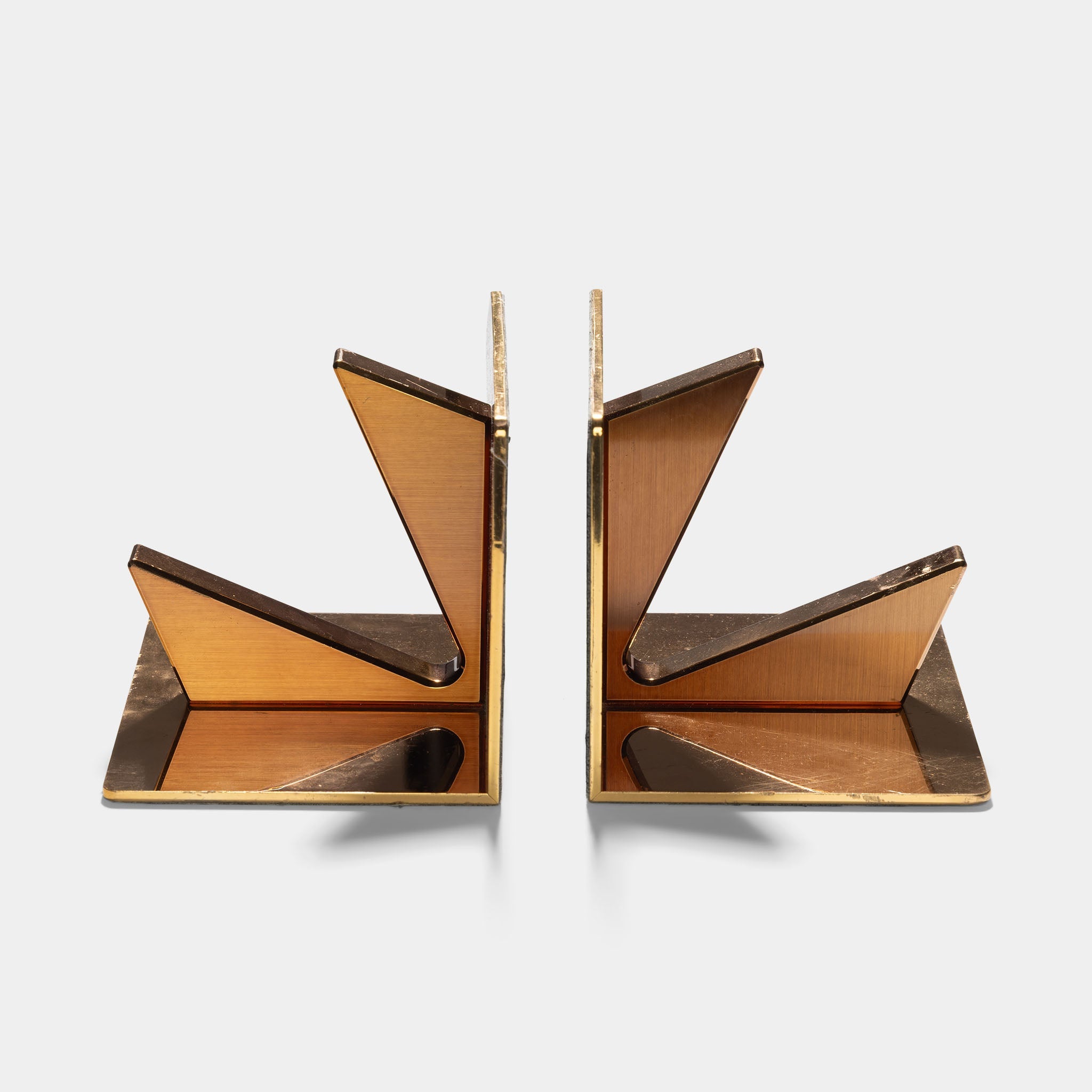 Vacheron & Constantin set of two brass bookshelves
