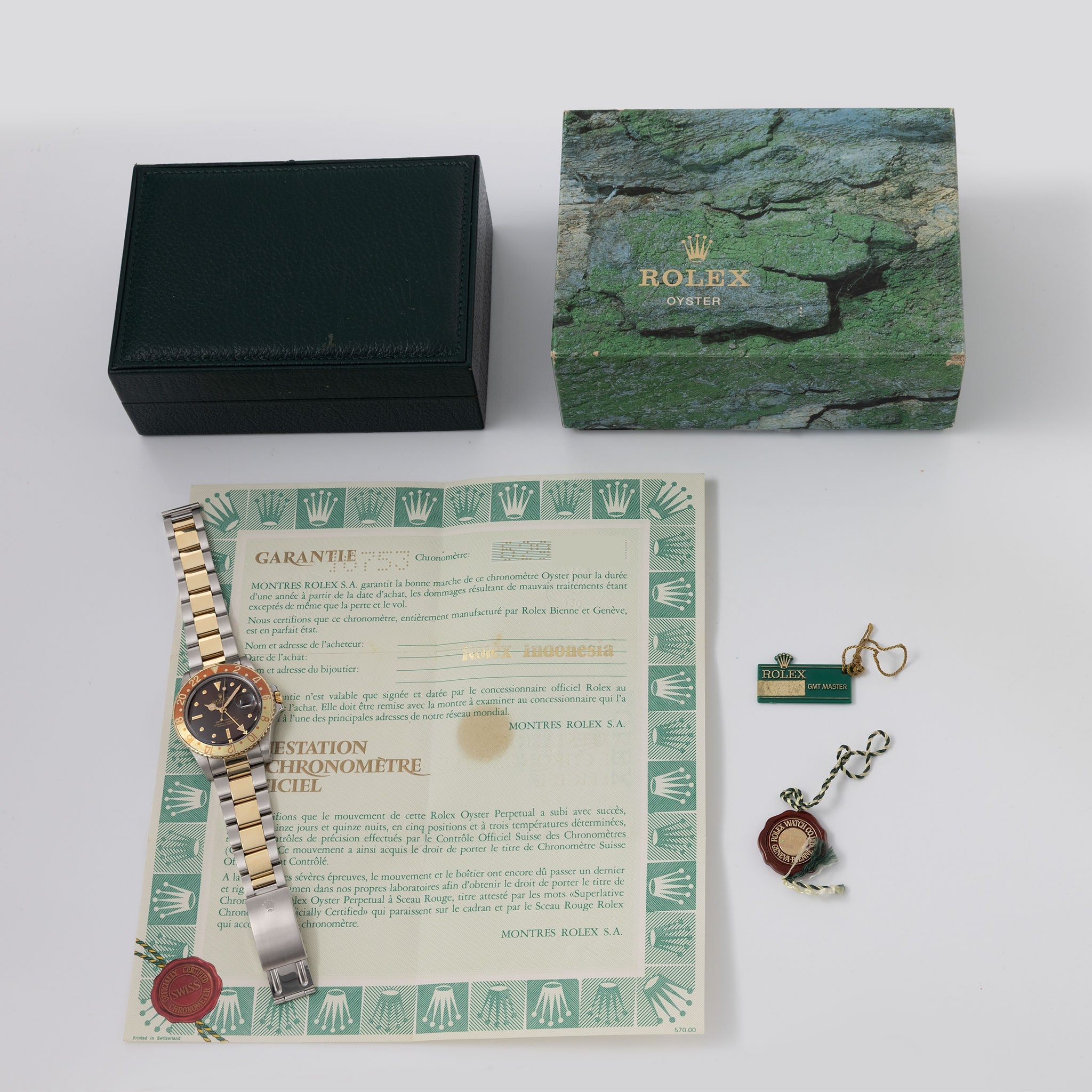 Rolex Gmt-master steel and gold Brown nipple dial box and punched paper set ref 16753