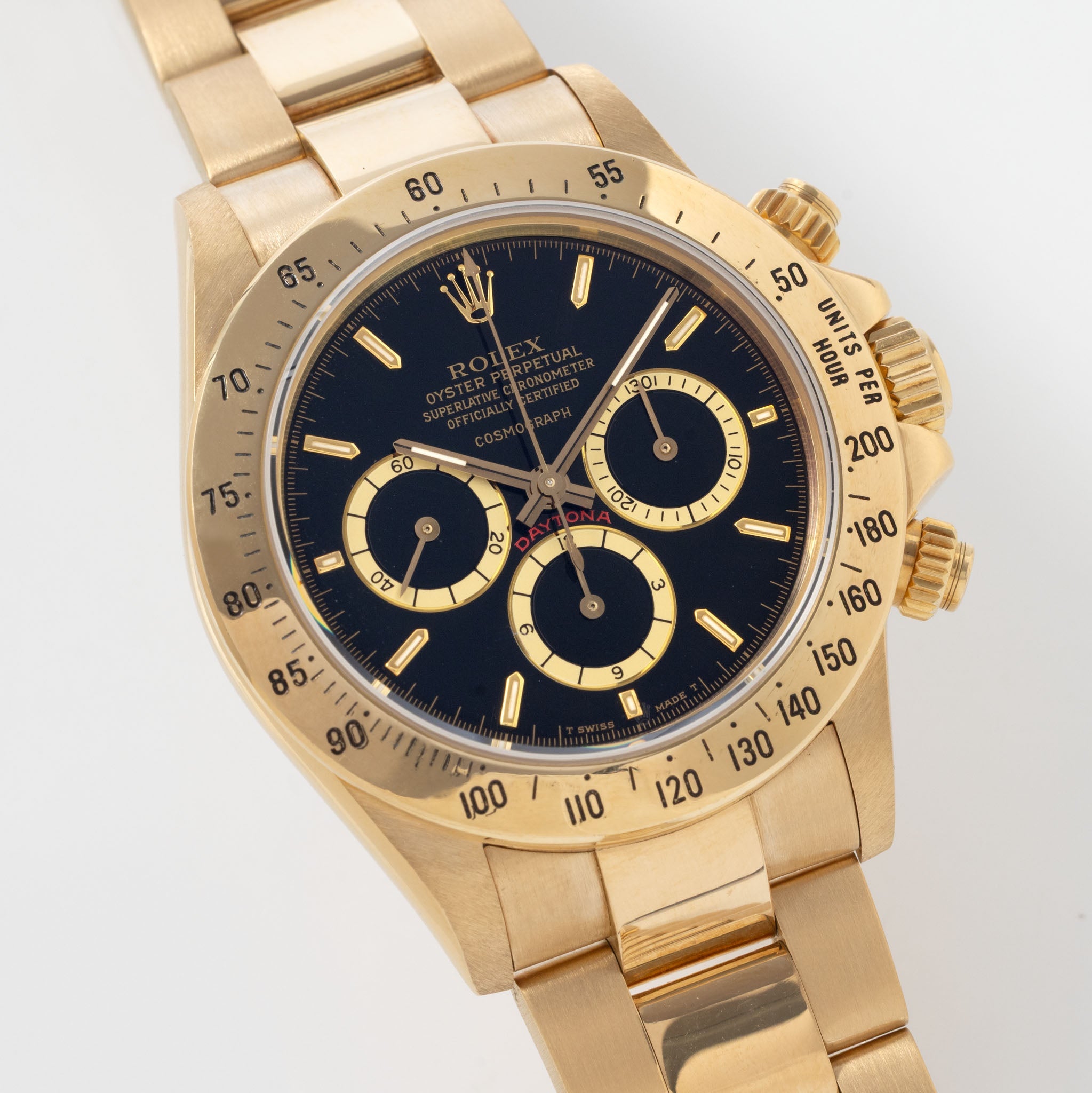 Rolex Cosmograph Daytona 16520 Black Floating Dial in 18k Yellow Gold with Original Guarantee Paper and Accessories
