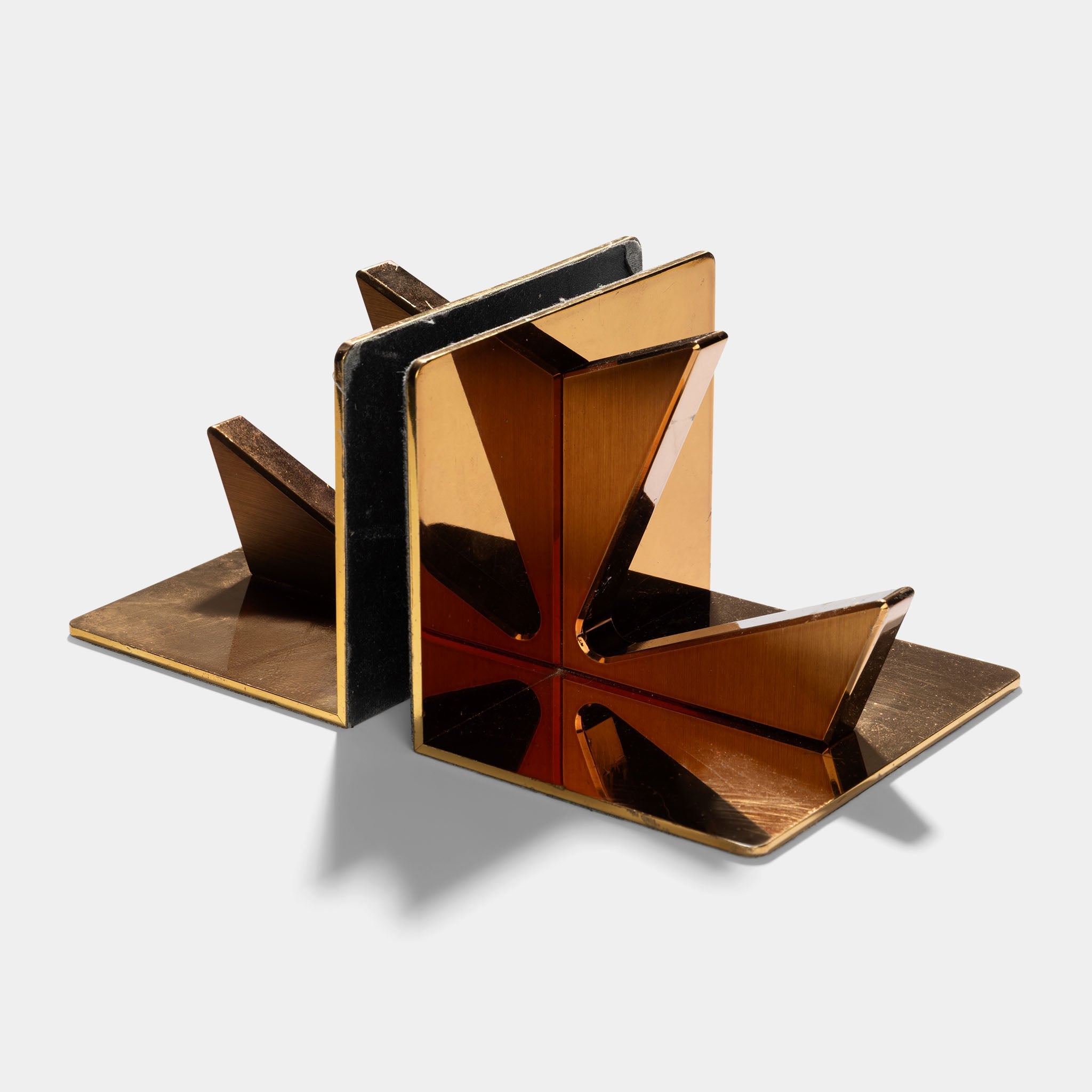 Vacheron & Constantin set of two brass bookshelves